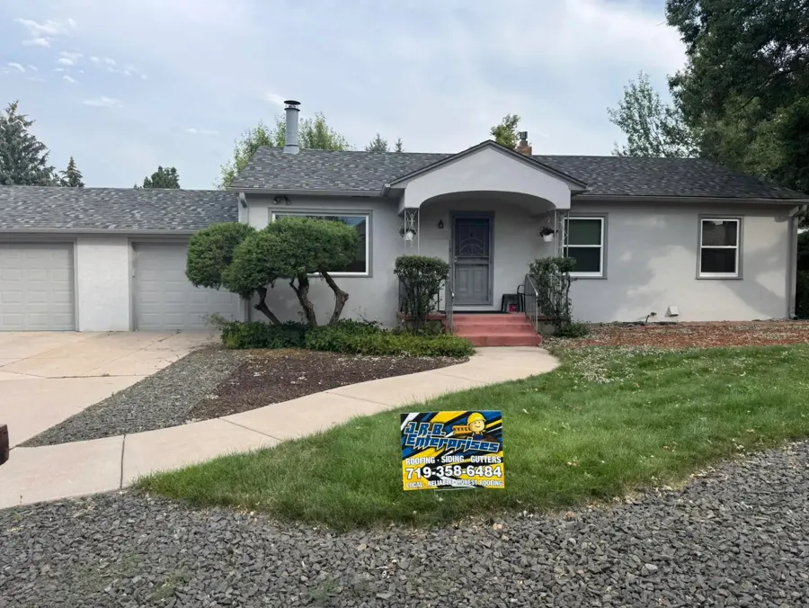 New shingle roof on a gray stucco home in Colorado Springs