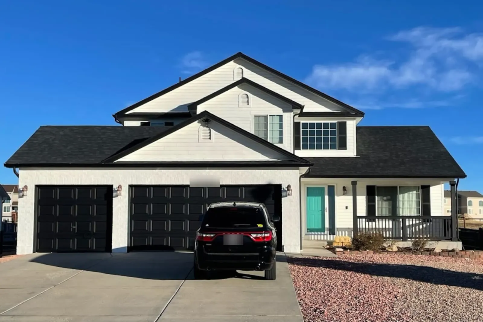 A home with a new black asphalt shingle roof